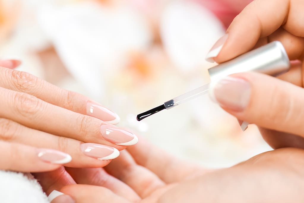 Woman painting gel nails