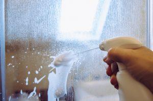 spraying glass shower doors