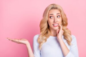 Woman biting nails