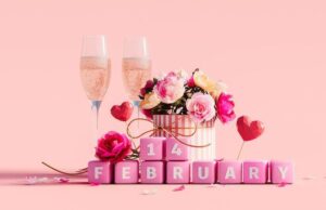 Valentine's day decoration and two champagne glasses on pink background