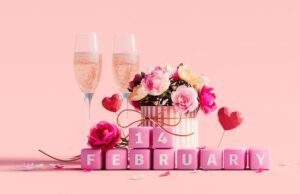 Valentine's day decoration and two champagne glasses on pink background