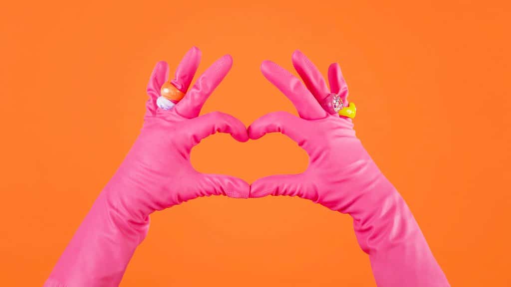 Pink gloves making a heart-clean and organized Home