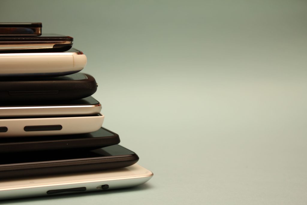 Pile of phones-digital clutter-how to declutter your digital life