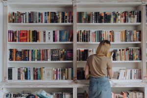 Blonde woman organising books