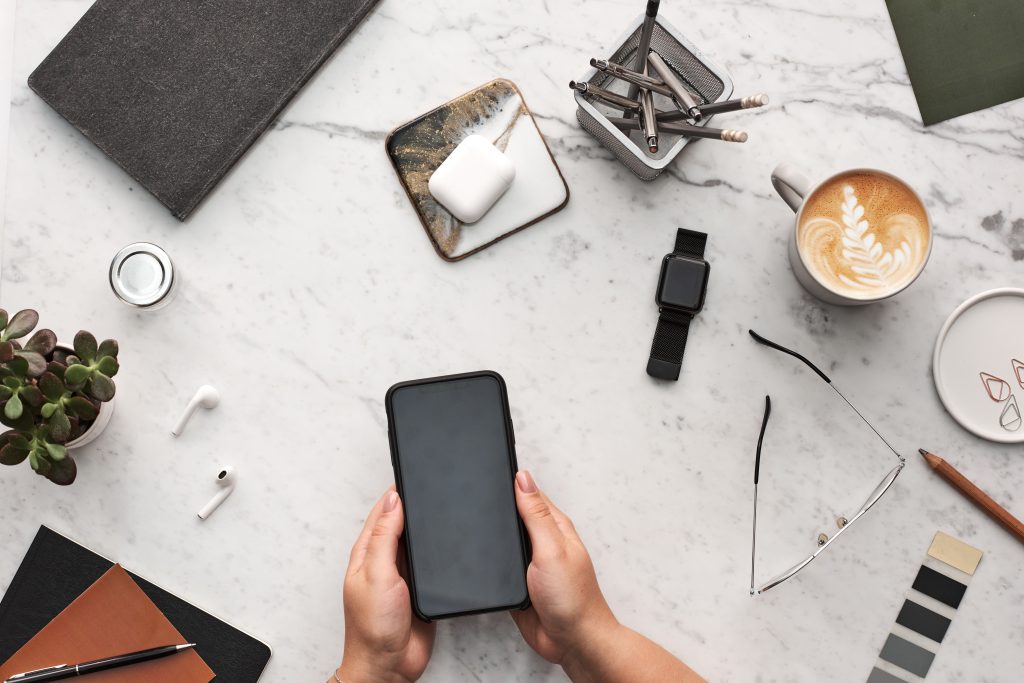 Person holding a black smartphone-how to declutter your digital life