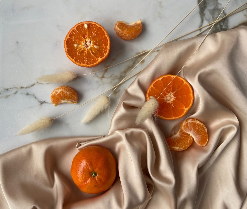 orange and tangerines on textile -keep the clothes in your closet smelling fresh 
