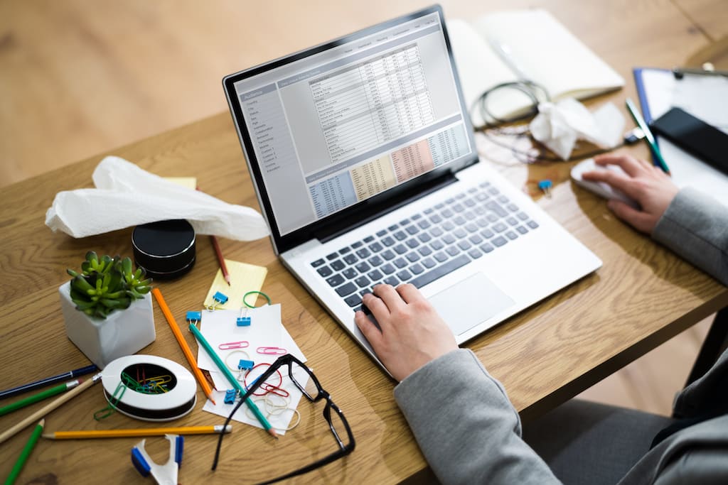 Unorganised and cluttered desk space