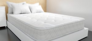 Bed and mattress white colour in a bedroom
