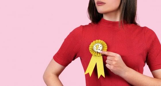 A woman holding a medal A woman holding a medal