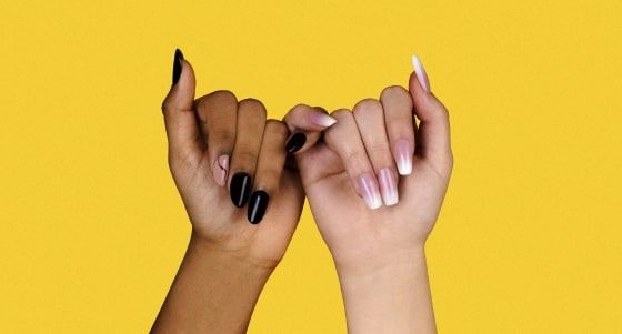 Two hands connected by the pinkie Two hands connected by the pinkie